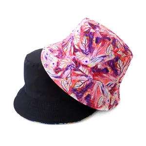Detailed view of the stylish double-sided bucket hat with vibrant floral print and solid black.