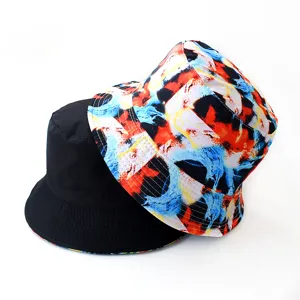 Reversible bucket hat featuring solid black on one side and vibrant abstract print on the other.