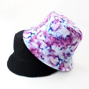 Reversible bucket hat detail showing purple tie-dye pattern and classic black side.