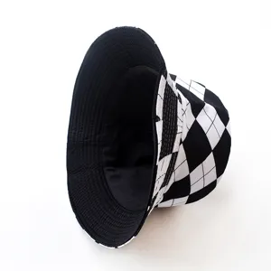 Trendy black and white checkered reversible bucket hat with a minimalist street style