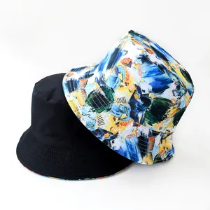 Double-sided bucket hat with abstract print and solid black design, perfect for outdoor use.