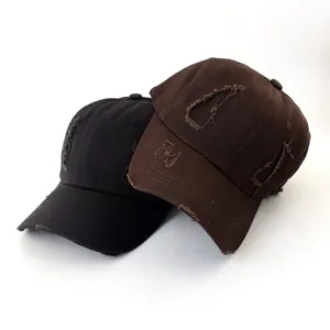 Detailed close-up shot showcasing retro distressed baseball caps featuring stylish ripped elements.