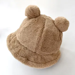 Detailed view of the soft plush fabric and bear ear design on the winter bucket hat.