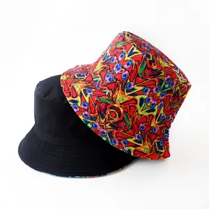 Reversible bucket hat detail, double sided design with digital print and solid black style.