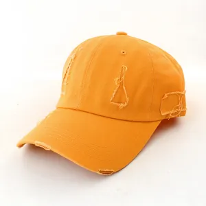 Distressed baseball cap details, orange cotton fabric with ripped holes, casual sun hat.
