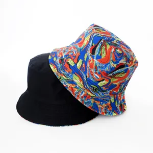 Detailed close-up view of the reversible bucket hat featuring classic black and vibrant print.