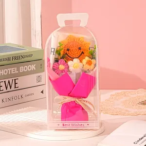 Detailed view of handmade crochet sunflower bouquet in a clear PVC gift box with handle
