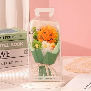 Detailed close-up of a handmade crochet sunflower bouquet inside a clear PVC gift box
