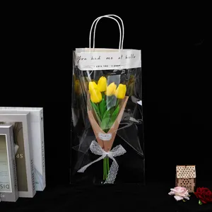 Bouquet de tulipes jaunes dans un sac cadeau transparent avec un design de texte élégant