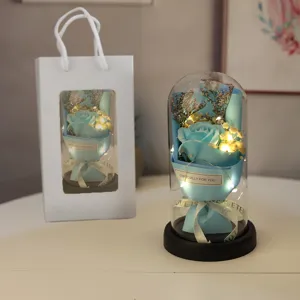 Blue everlasting rose glass dome with fairy lights and gift bag for romantic occasions.