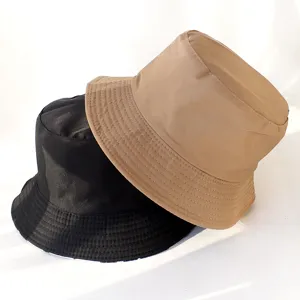 Detailed view of the trendy double-sided bucket hat, stylish sun protection for women.