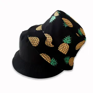 Detailed view of the stylish double-sided bucket hat featuring a trendy pineapple print.