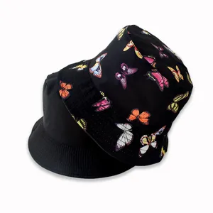 Reversible bucket hat for women featuring a colorful butterfly print on black fabric.