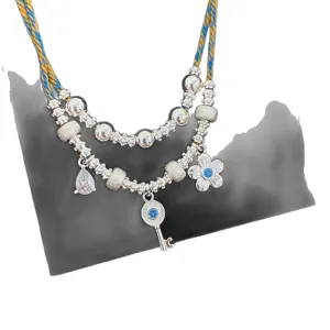 Collana a doppio strato retrò con chiave e fiori blu