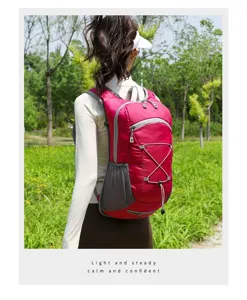 Detailed view of a rose red lightweight outdoor sports backpack for cycling and hiking