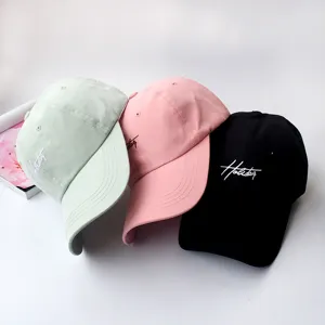 Detail view of versatile cotton soft-top baseball caps in three classic colors with chic embroidery.
