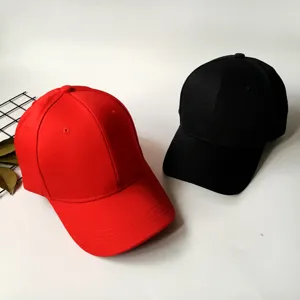 Two classic cotton baseball caps in red and black colors for casual sun protection style