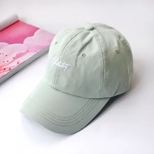 Light green soft top baseball cap detail, casual embroidered cotton sun hat for daily wear.