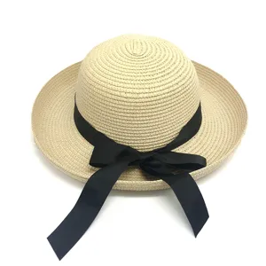 Elegant summer straw sun hat for women with a wide brim and decorative black ribbon bow