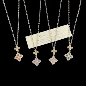 Detailed view of ornate vintage four-petal flower necklaces with colorful crystals