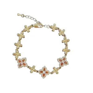 Luxurious gold-plated bracelet featuring vintage colorful four-leaf flower charms and crystals