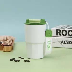 Tazza da caffè isolata sottovuoto in acciaio inossidabile con cinturino e coperchio.