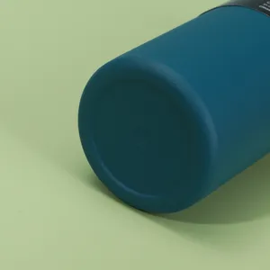 Stainless steel insulated water bottle bottom detail view, portable outdoor sports thermos cup.