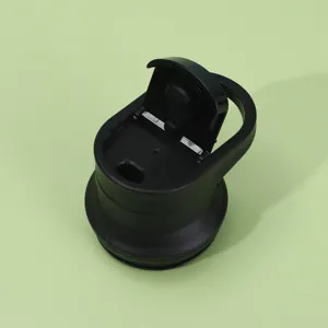 Detailed view of a black replacement bottle cap with a portable handle and flip-top lid design.
