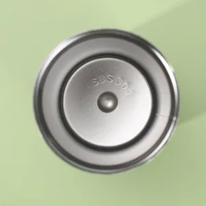 Detail shot showing the 304 stainless steel interior of a durable portable water tumbler.