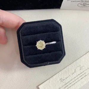 Detailed view of fireworks cut yellow gemstone ear cuff inside a black velvet box