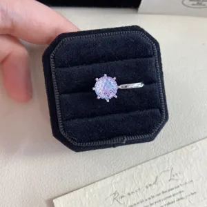 Detailed view of firework cut stone ear cuff nestled in a black velvet jewelry box
