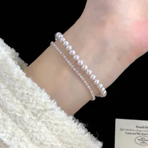 Elegante conjunto de joyas de doble capa con perlas rosas y piedras de circonita rosa/blanca