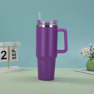 Close-up of a 40oz purple insulated tumbler with ergonomic handle and clear straw
