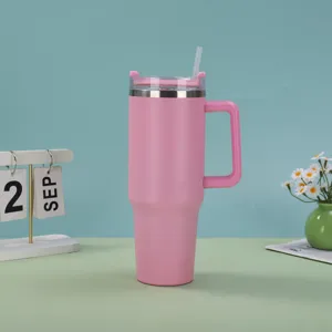 Detail view of 40oz pink stainless steel tumbler with handle and straw in setting