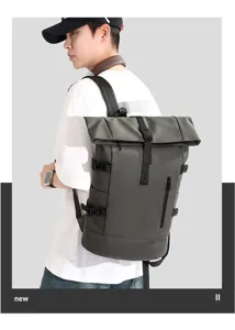Model wearing a large capacity roll-top business laptop backpack in dark grey finish