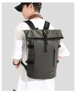 Back view of a male model wearing a large green roll-top business laptop backpack