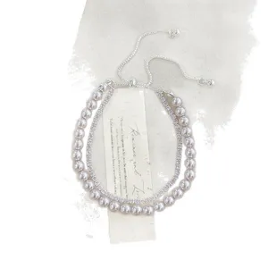 Pulsera elegante de doble capa de perlas y circonitas con cierre ajustable