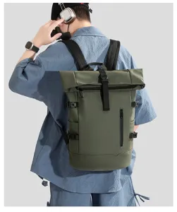Man wearing a green roll-top waterproof outdoor backpack for business or travel