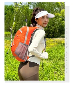 Asian female model wearing a lightweight orange hiking backpack in a forest setting