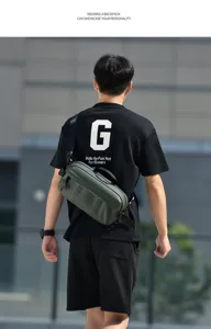Model from behind wearing a trendy dark green water-resistant men's crossbody bag.