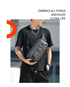 Urban male model wearing a black water-repellent sling bag in a street setting