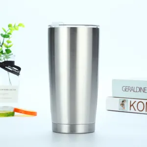 Stainless steel tumbler detail shot showing brushed metal finish and clear lid design.