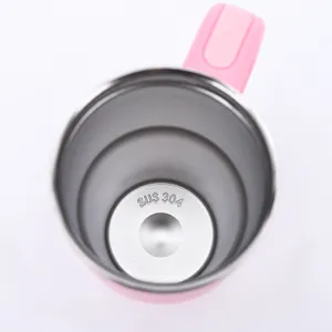 Detailed close-up view of the internal 304 stainless steel lining of a pink insulated mug