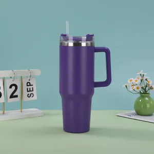 Purple 40oz insulated stainless steel tumbler with handle and straw on a desk