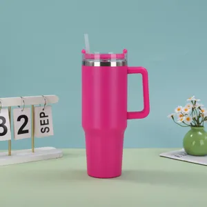 Detailed macro view of the hot pink 40oz insulated tumbler with handle and straw