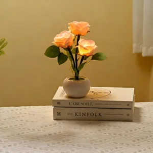 Detailed view of artificial rose flower ceramic table lamp, warm ambient light, cozy room decor.