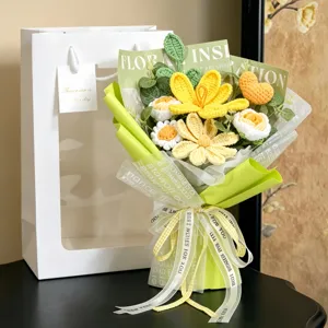 Detail of handmade crochet bouquet with yellow flowers and orange heart in green wrap