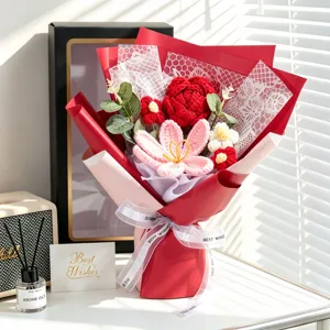 Detailed view of handmade crochet rose and tulip bouquet in elegant red wrapping