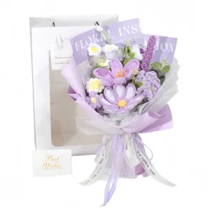 Elegant hand-crocheted purple yarn flower bouquet set with white gift bag and card.