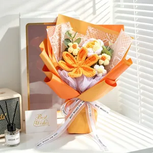 Handmade crochet flower bouquet gift featuring orange and white knitted yarn flowers